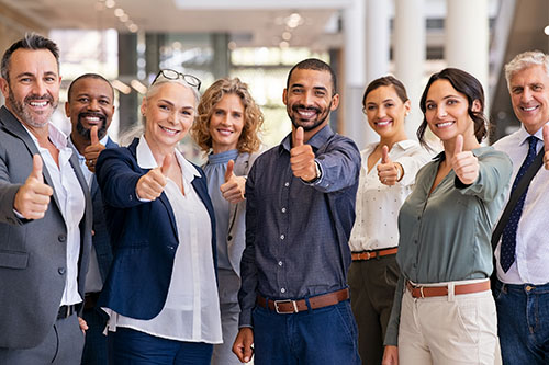Diverse business team showing thumbs up